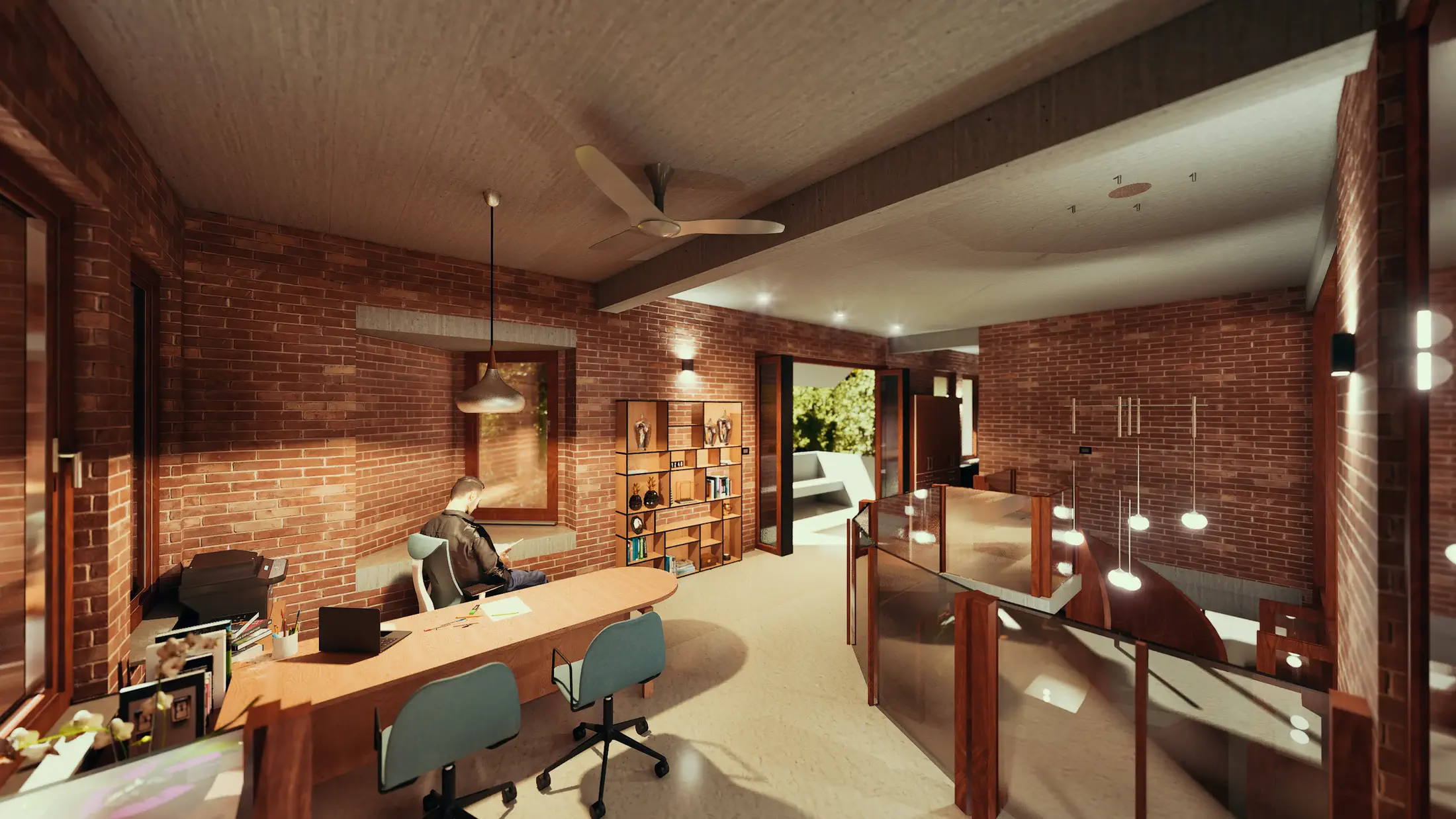 Upper floor studio: long timber desk with two chairs, open shelving behind, pendant lights, exposed brick walls, balcony door to the garden beyond, bathroom partition visible to the right