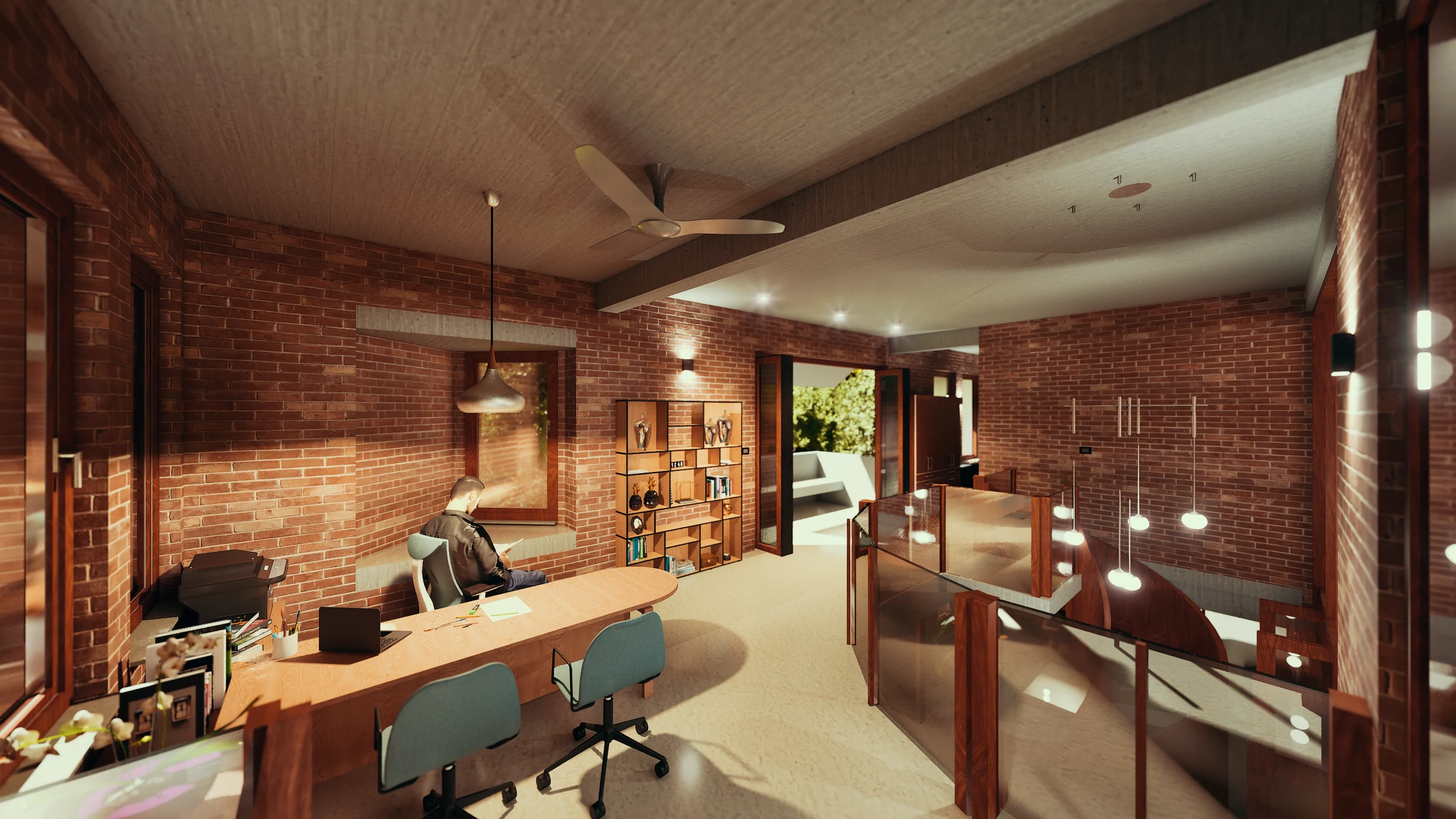 Upper floor studio: long timber desk with two chairs, open shelving behind, pendant lights, exposed brick walls, balcony door to the garden beyond, bathroom partition visible to the right