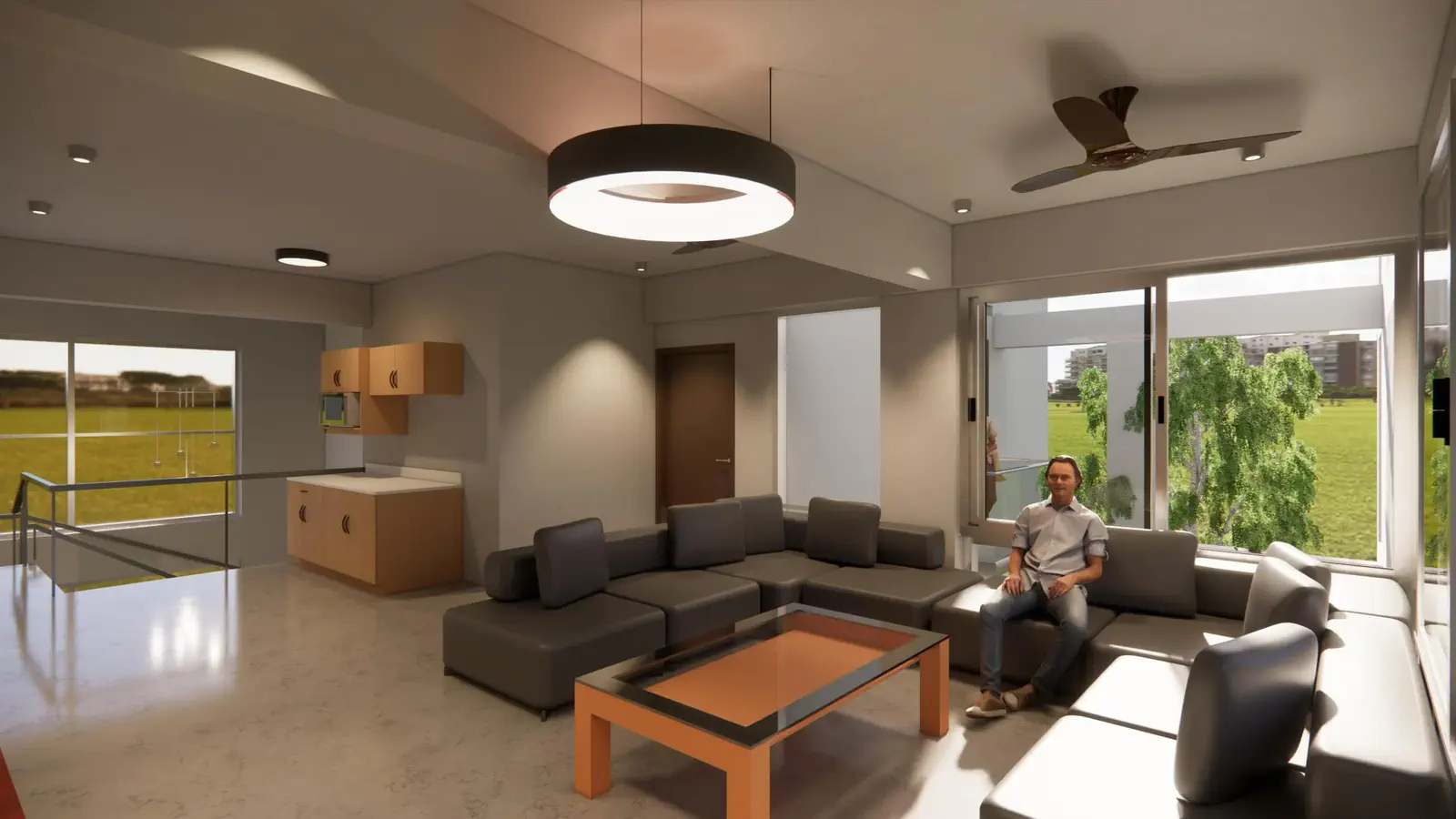 Duplex upper floor family living: generous lounge at the landing with kitchenette behind, balcony to the left opening to open fields