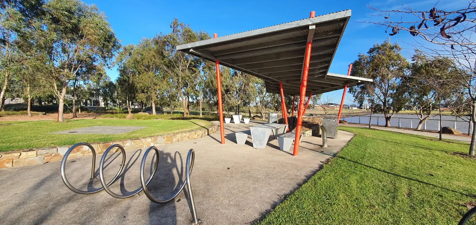 Lakeside park with shelter and bike rack: public amenity