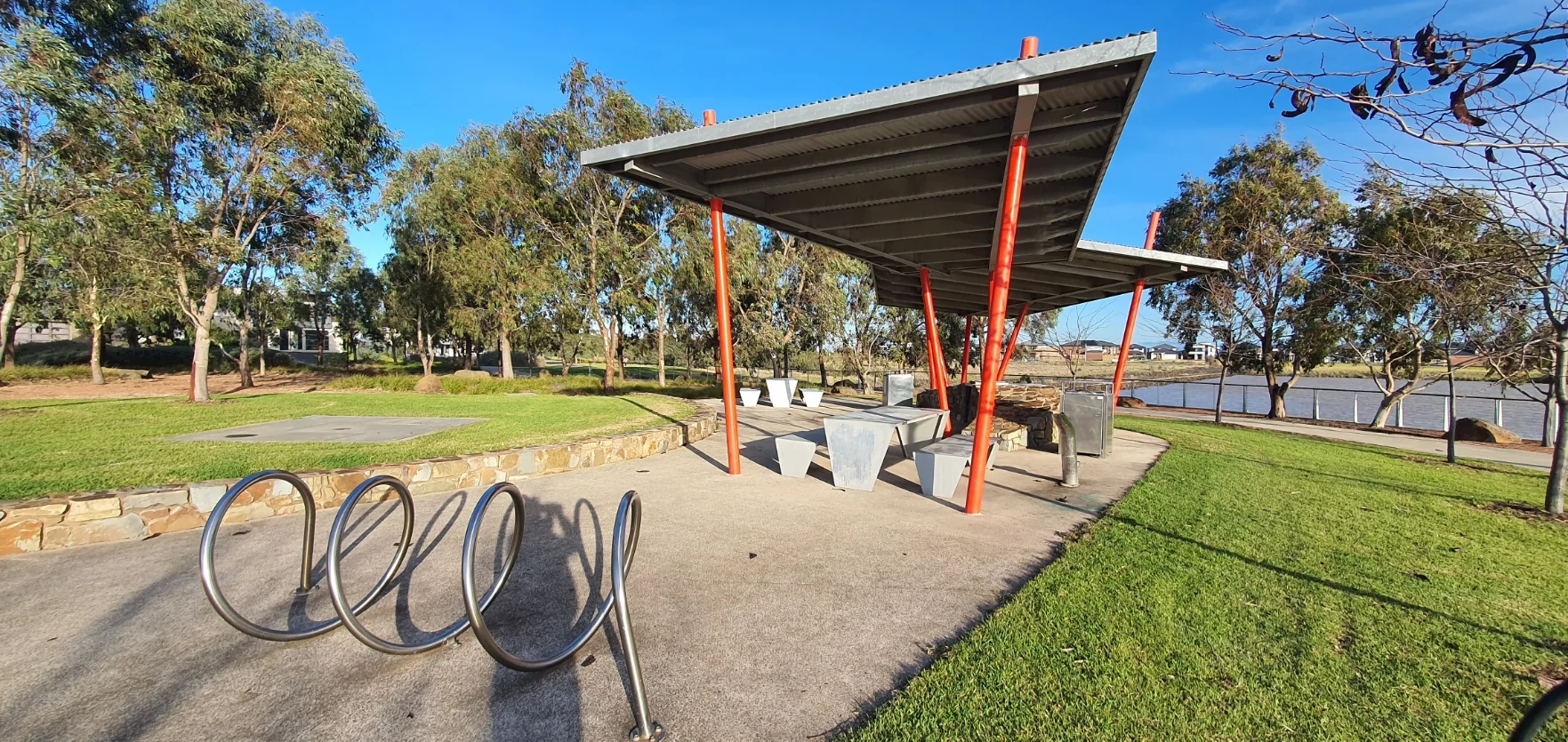 Lakeside park with shelter and bike rack: public amenity