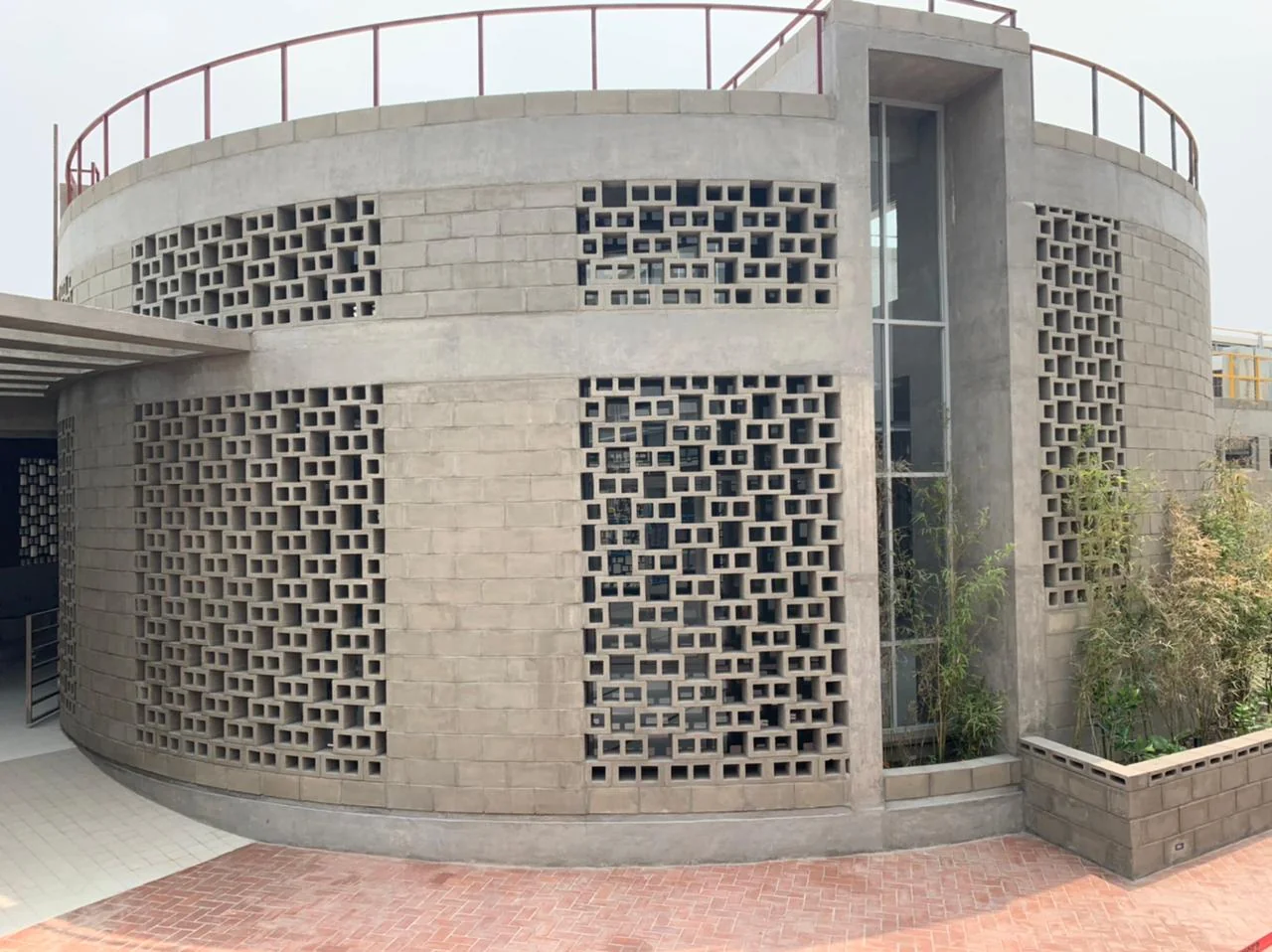 Mosque as-built: close view of lattice concrete block screen, curved wall
