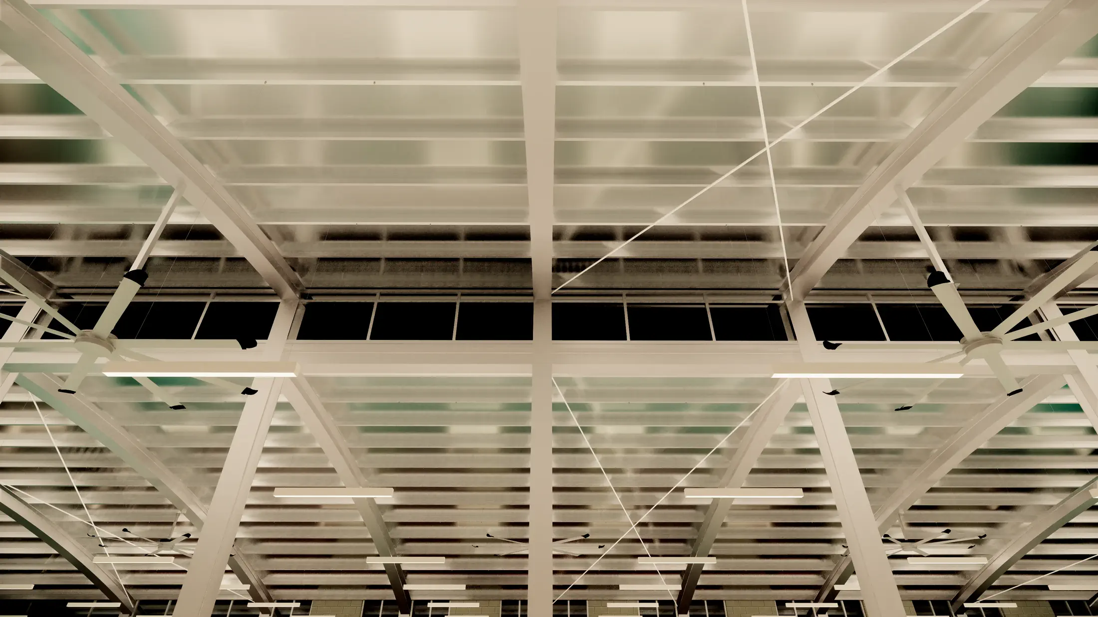 Canteen roof structure: barrel vault steel frame with translucent deck panels