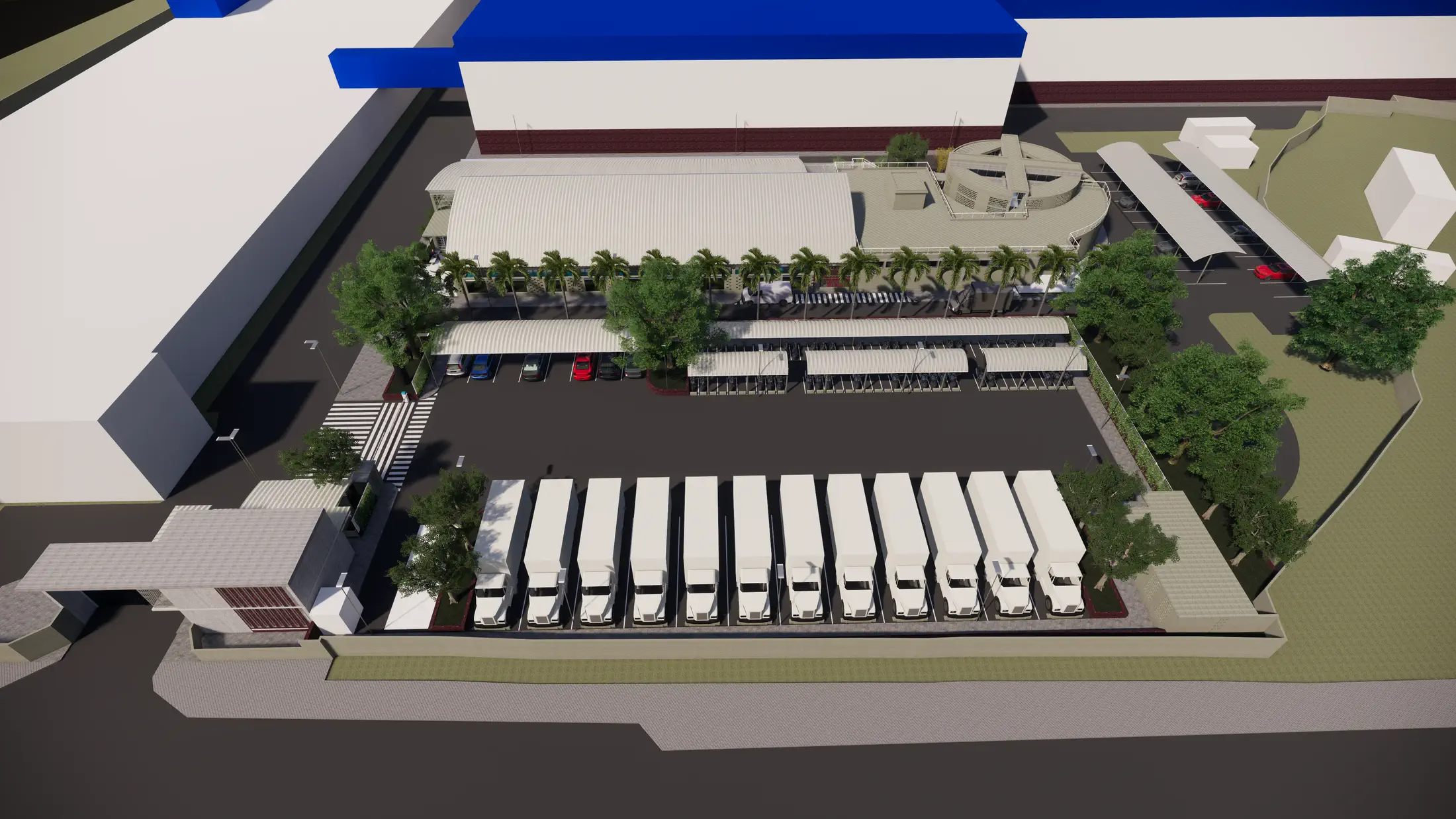 Truck parking aerial: fleet bays, car park, and gatehouse within the factory campus