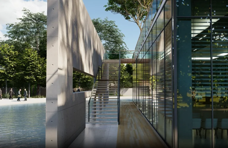 Approach to the plaza: the landscaped ramp sequence ascending from the ground level to the elevated platform, dense plantation framing the path, the resort blocks rising on either side