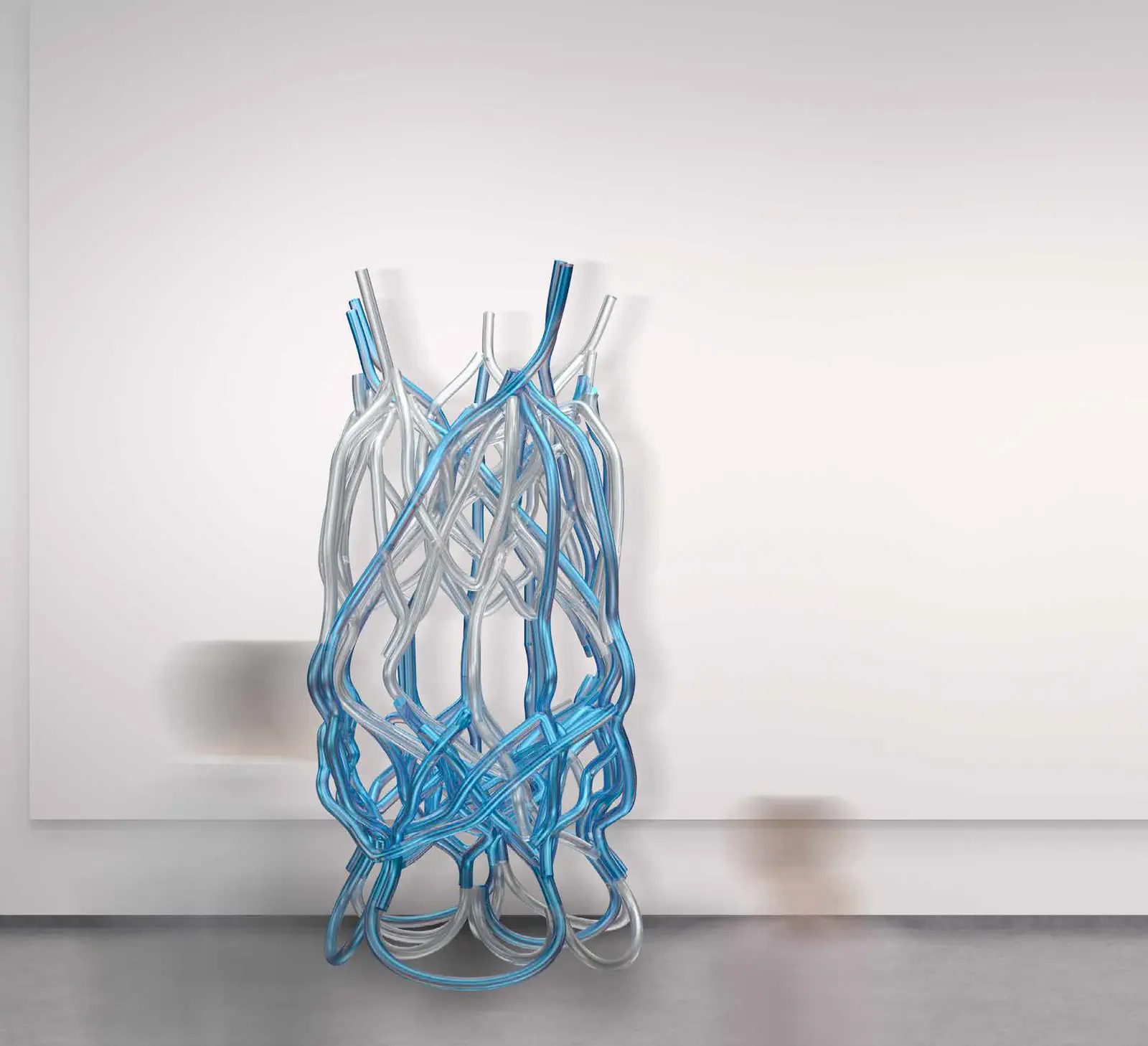 Completed Tubythm model: full PETG tube structure photographed in the studio, branching spatial form rising from base