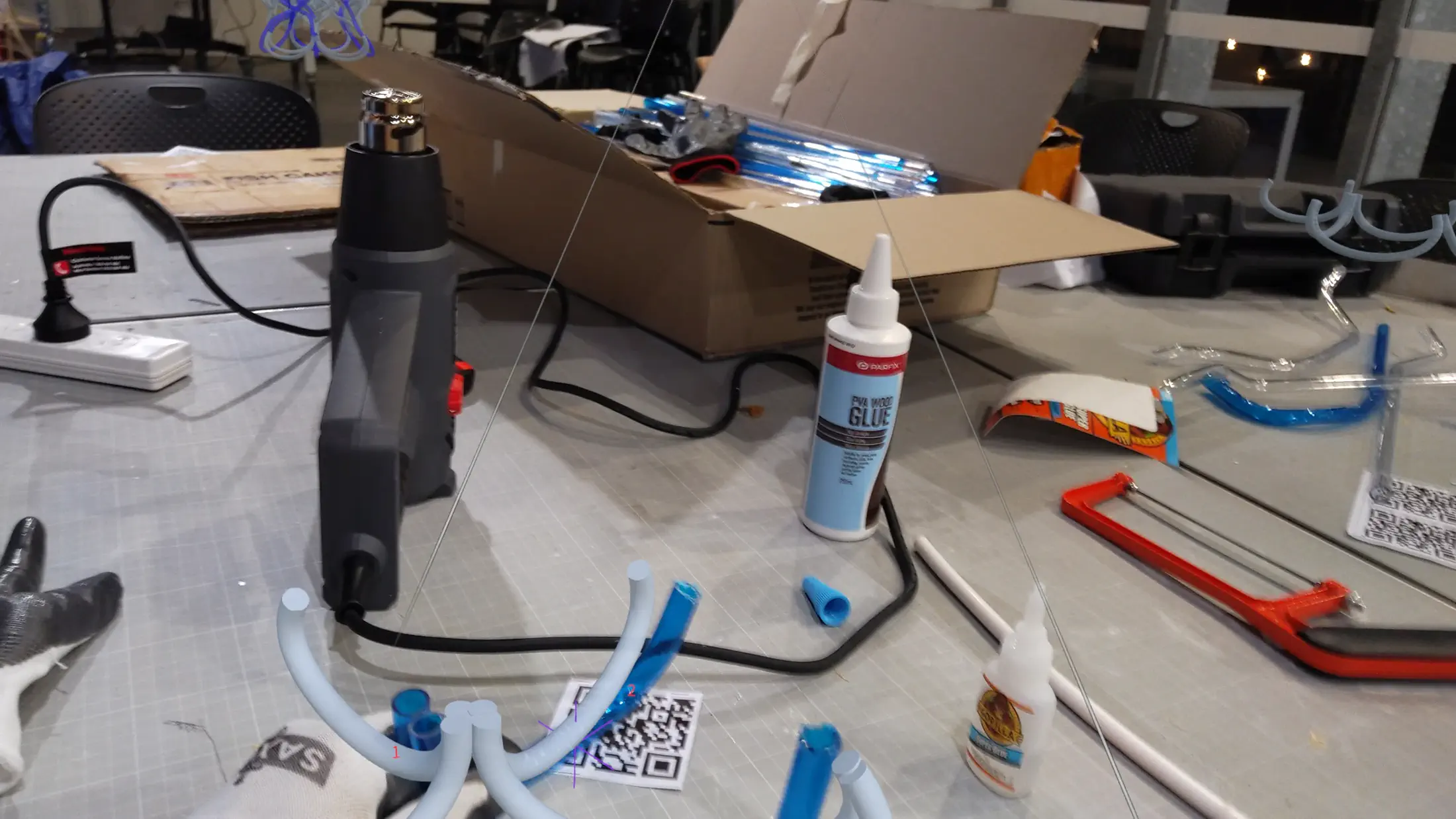 HoloLens capture: UPVC joint being inserted with AR tolerance guide verifying overlap length in real time