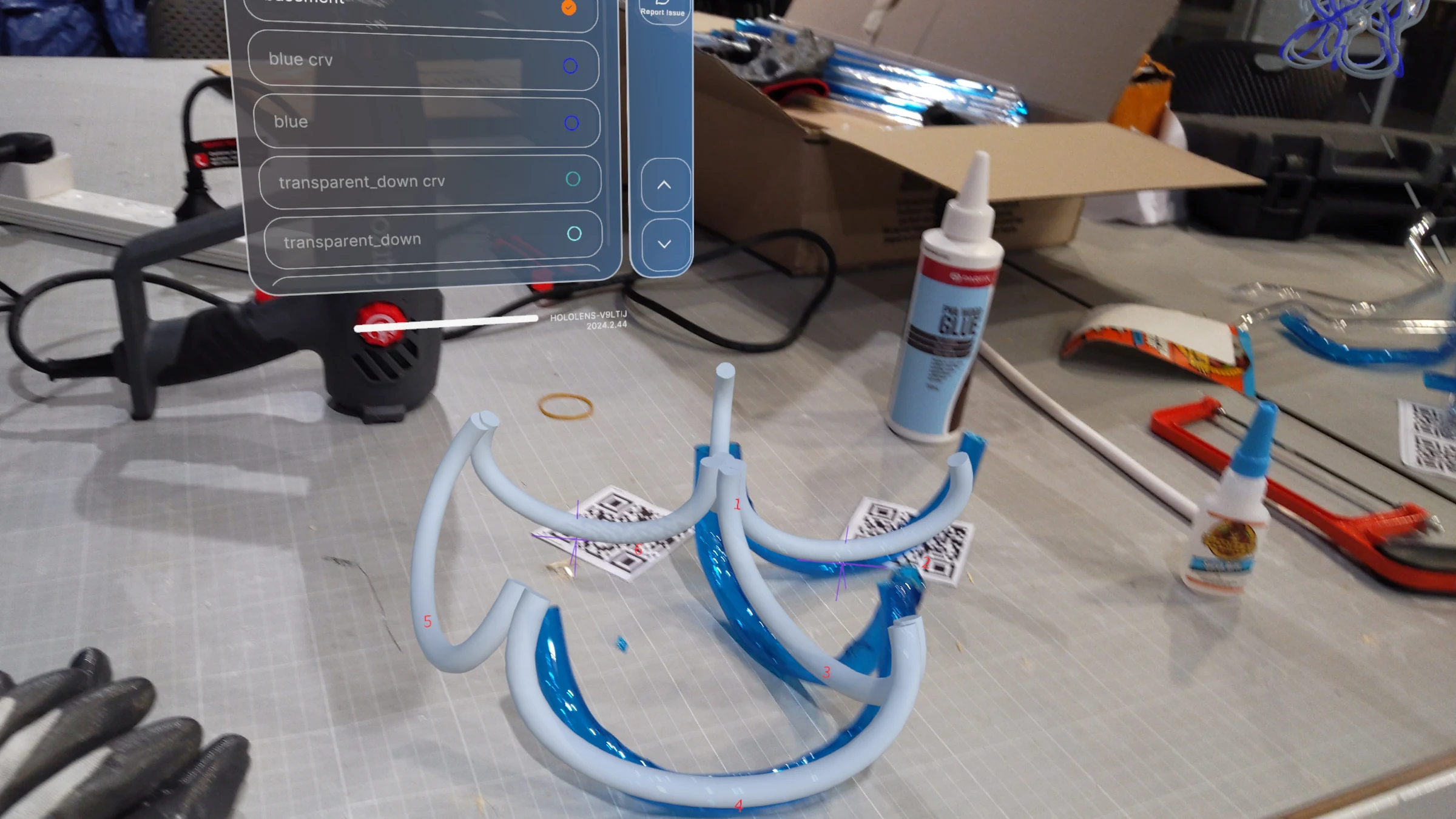 HoloLens capture: final assembly phase, last tubes being positioned within the completed lower and mid-section framework