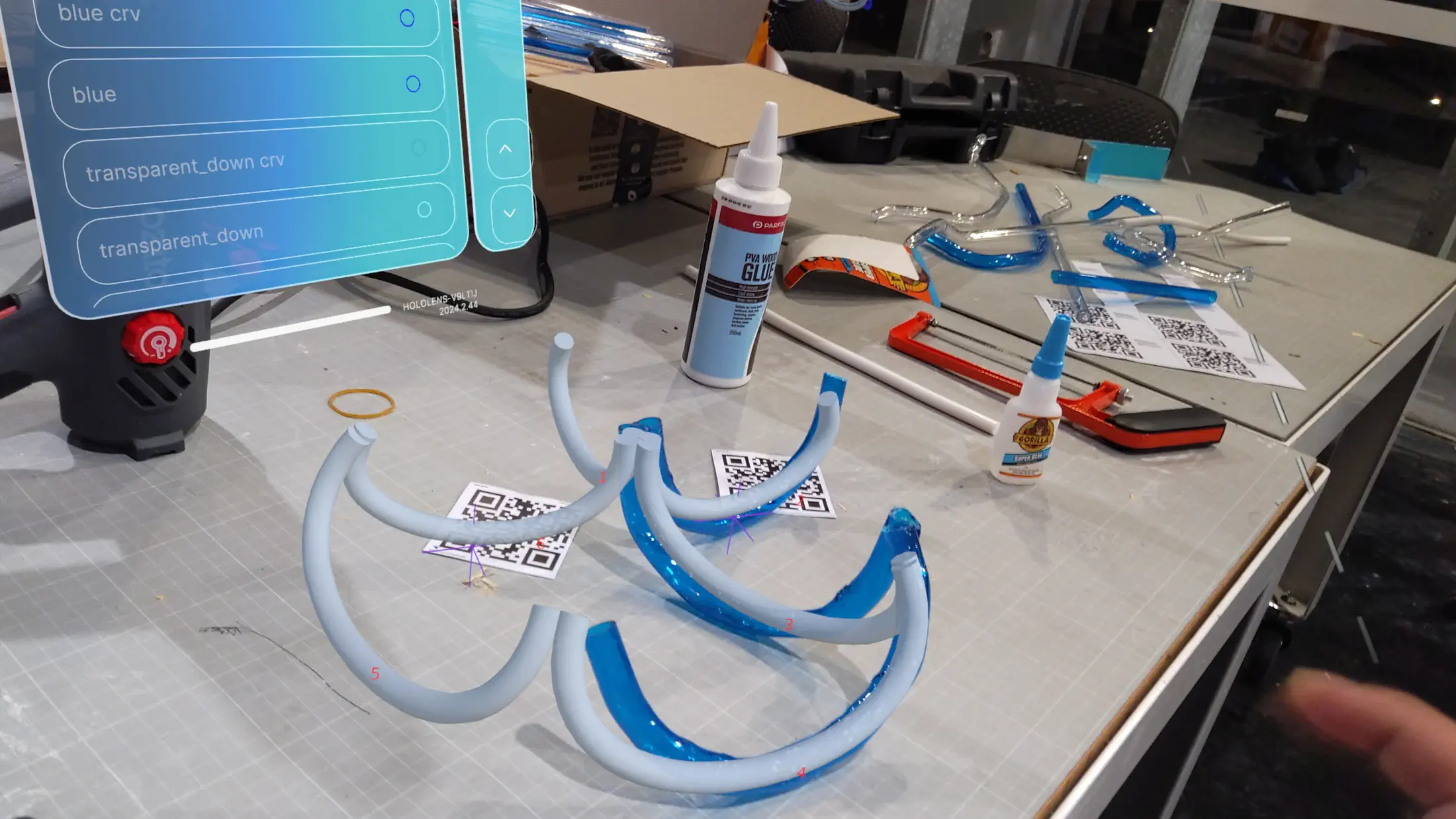 HoloLens capture: completed Tubythm structure viewed through the Mixed Reality display — physical PETG tube form and digital model in full alignment